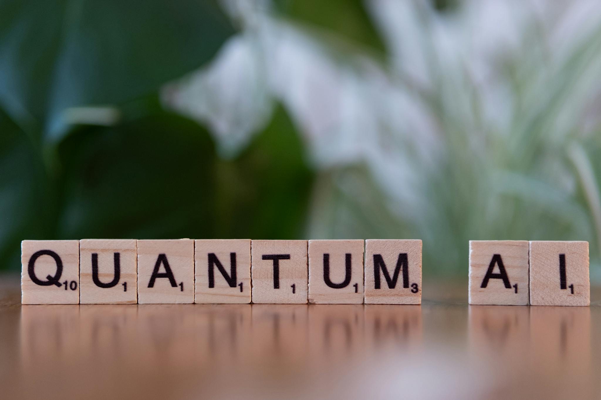 Wooden letter tiles spelling 'Quantum AI' on a blurred background.