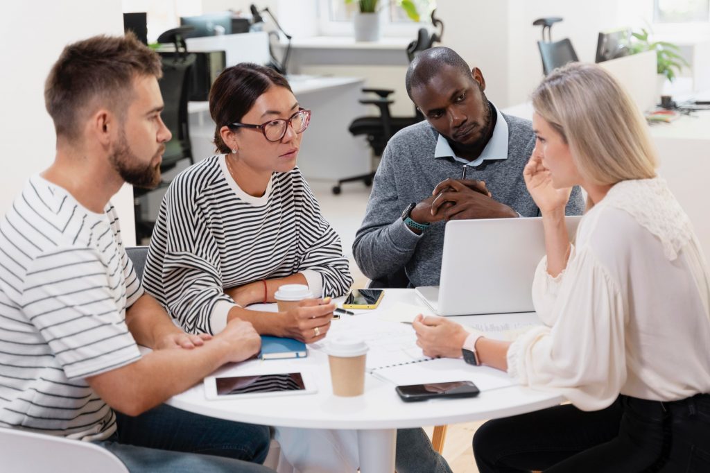 The AI Automation Quick-Start Cheat Sheet: 5 Tasks Small Businesses Should Automate This Week 1 close up young colleagues having meeting 1024x682 1 AI Drives Biz